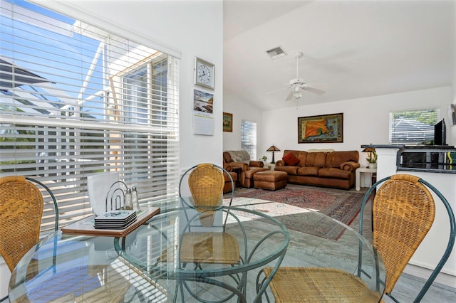 living room with vaulted ceiling and ceiling fan