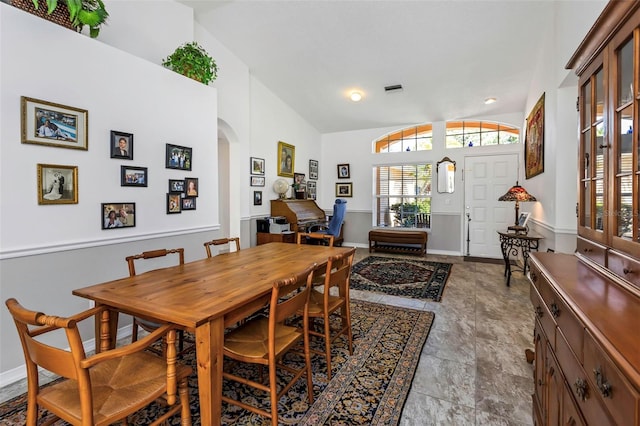 dining room with lofted ceiling