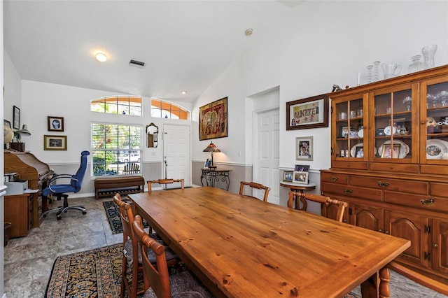 dining room featuring lofted ceiling