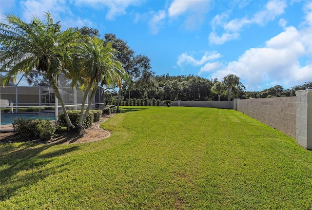 view of yard featuring a lanai