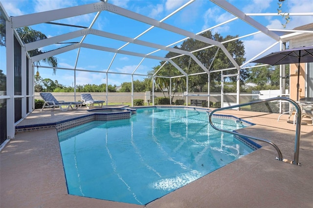 view of swimming pool with a patio area and glass enclosure