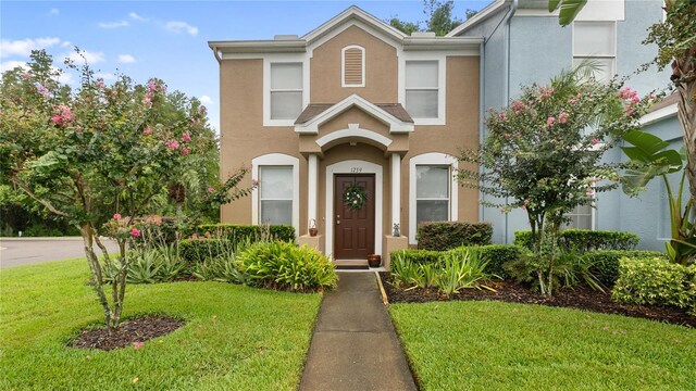 view of property with a front lawn