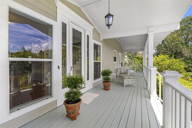 wooden terrace with a porch