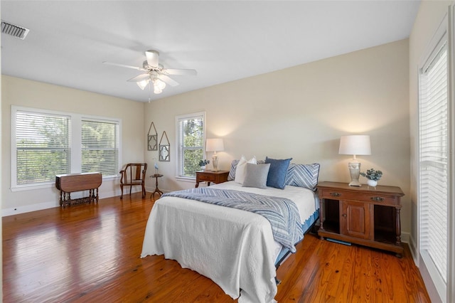 bedroom featuring ceiling fan and dark hardwood / wood-style flooring