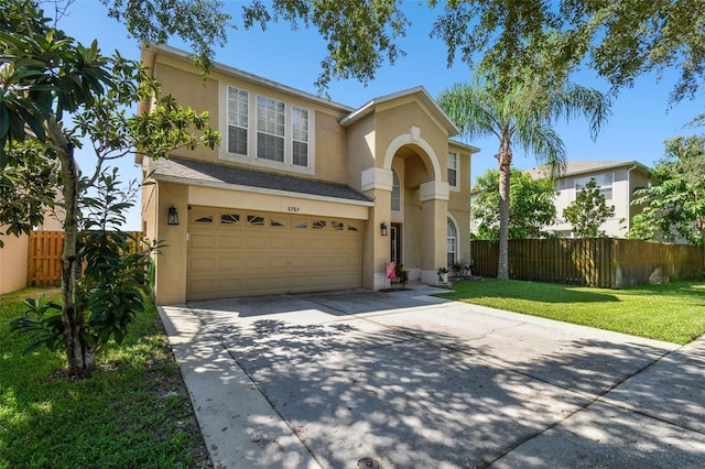 view of front facade featuring a garage and a front yard