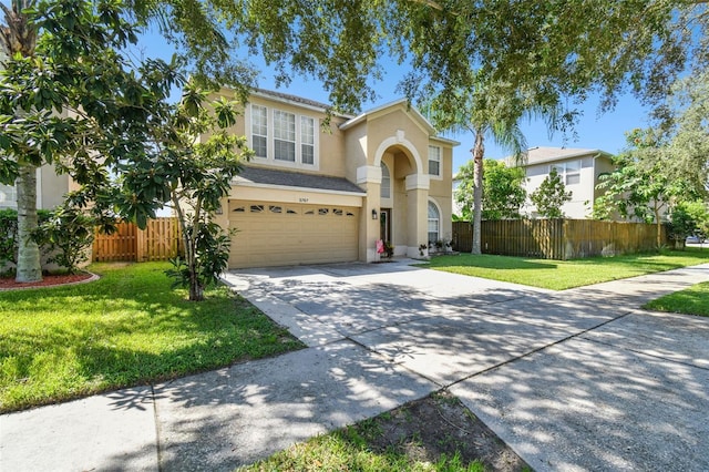 view of front of house with a garage and a front yard