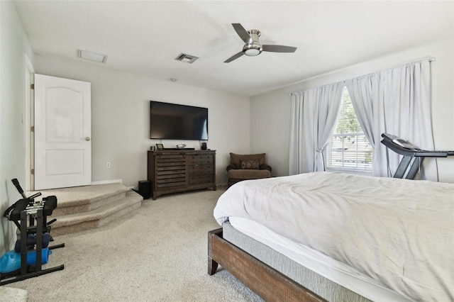 bedroom with ceiling fan and light colored carpet