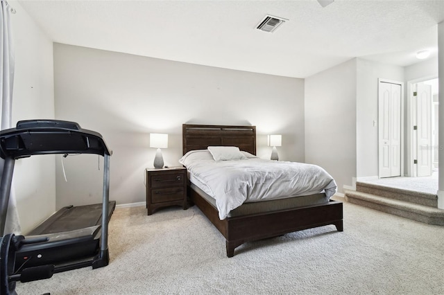 carpeted bedroom featuring a closet