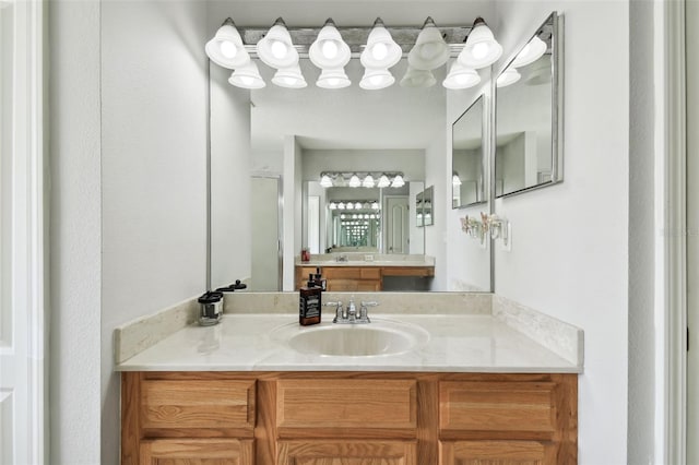 bathroom with vanity and an enclosed shower