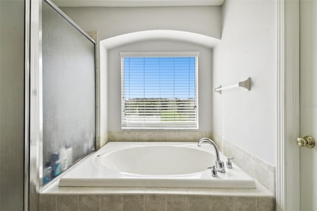 bathroom with separate shower and tub