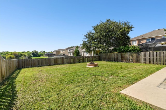 view of yard with an outdoor fire pit