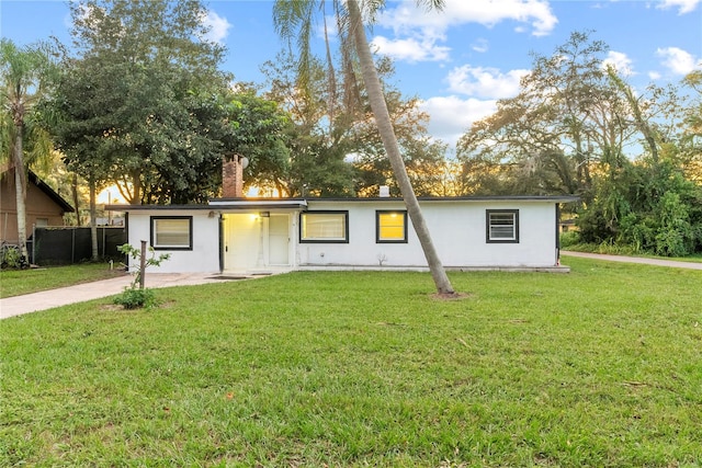 ranch-style house with a front yard