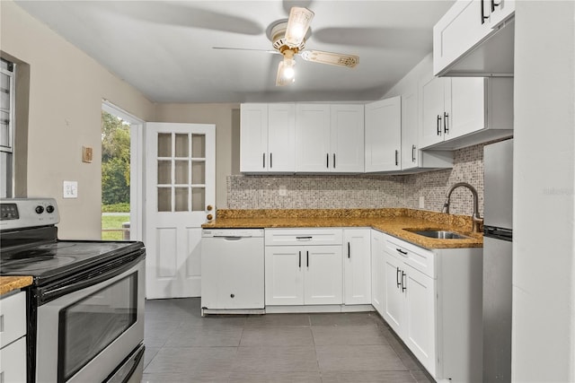 kitchen featuring ceiling fan, appliances with stainless steel finishes, sink, and white cabinetry