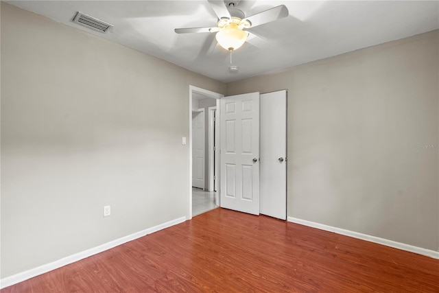 unfurnished bedroom featuring ceiling fan and wood-type flooring