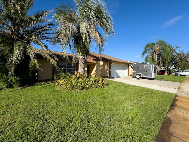 view of front facade featuring a garage, a front lawn, driveway, and stucco siding