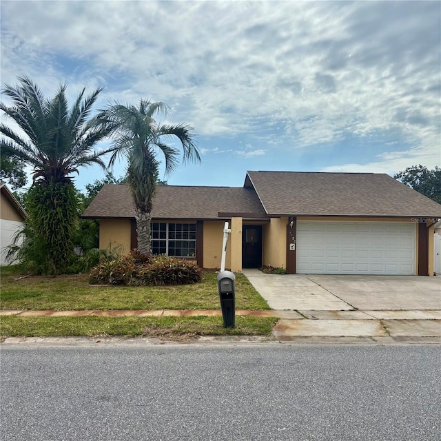 7702 Ivory Ter, New Port Richey, FL 34655 - view of front of property featuring a garage, driveway, a shingled roof, and a front yard