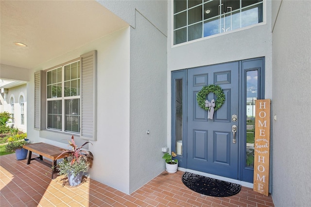 doorway to property with a porch