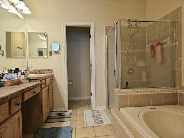 bathroom featuring tile patterned flooring, vanity, and separate shower and tub