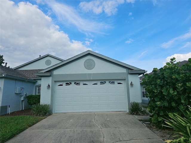 ranch-style house featuring a garage