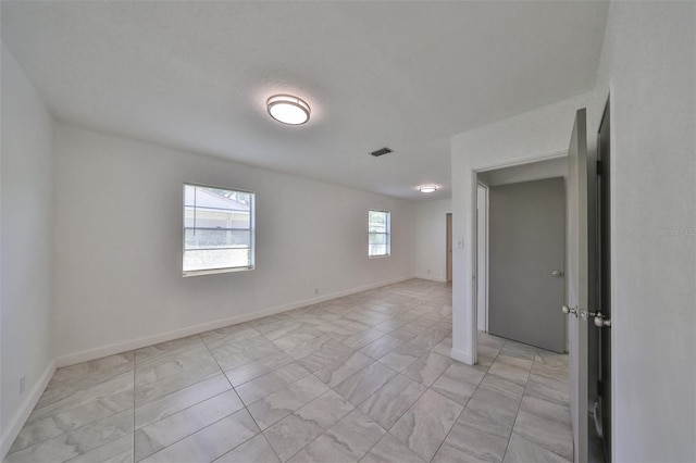 3908 W Wallace Ave, Tampa, FL 33611 - unfurnished room with visible vents and baseboards