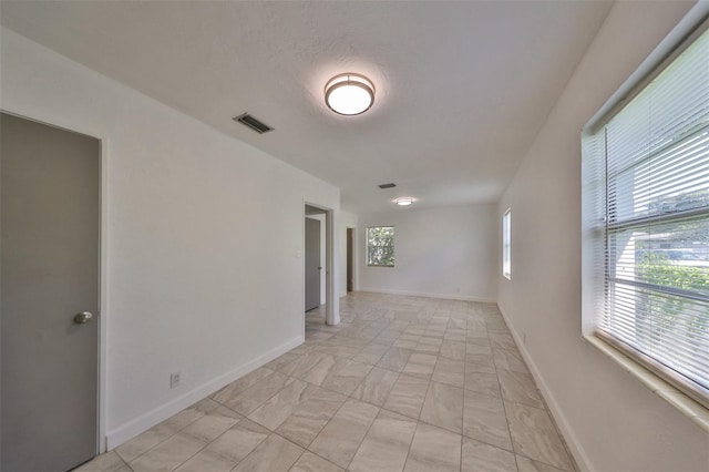 3908 W Wallace Ave, Tampa, FL 33611 - spare room with baseboards and visible vents