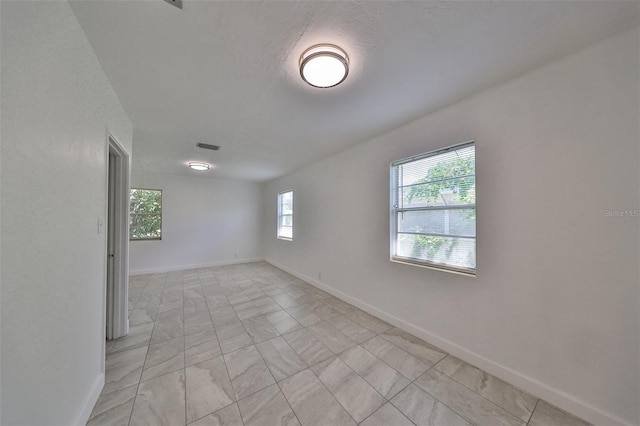 3908 W Wallace Ave, Tampa, FL 33611 - empty room featuring baseboards