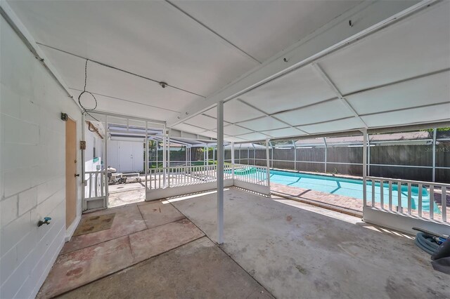 3908 W Wallace Ave, Tampa, FL 33611 - view of swimming pool featuring a patio, a fenced backyard, a fenced in pool, and glass enclosure