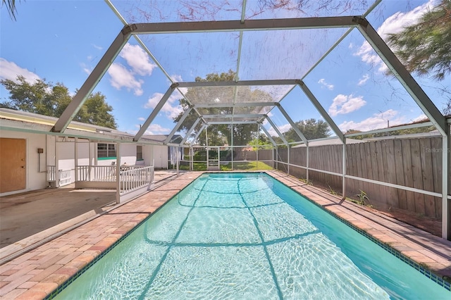 3908 W Wallace Ave, Tampa, FL 33611 - view of pool featuring a patio area, a fenced in pool, and glass enclosure