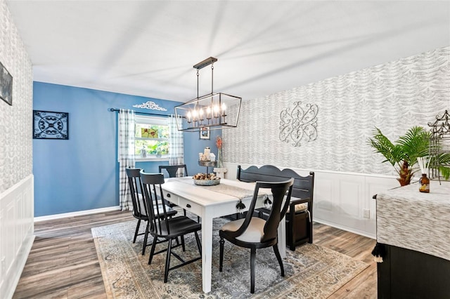 dining room with a chandelier and hardwood / wood-style floors