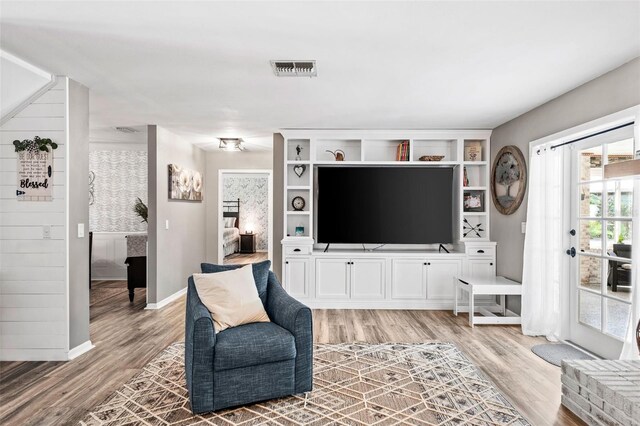 living room with light hardwood / wood-style flooring