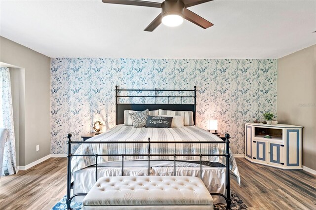 bedroom featuring wood-type flooring and ceiling fan