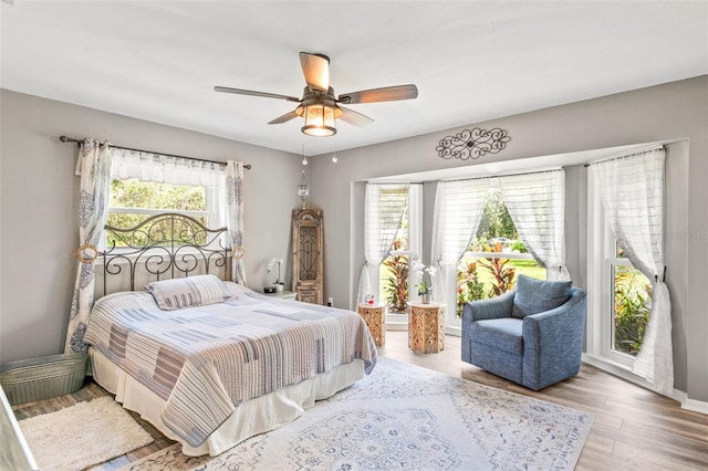 bedroom with ceiling fan and wood finished floors