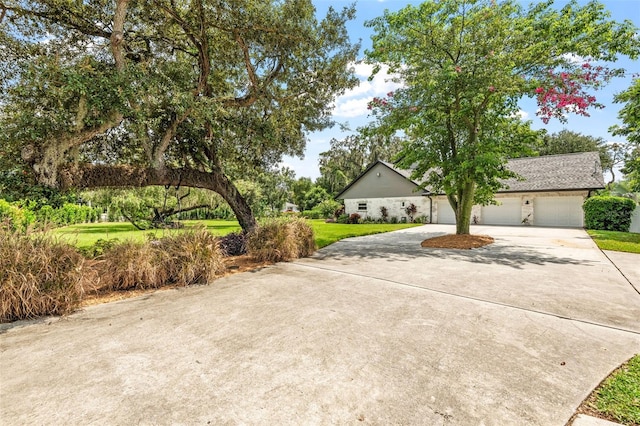 view of front of house with a front yard and a garage