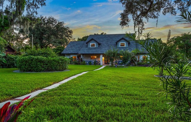 view of front of home with a lawn