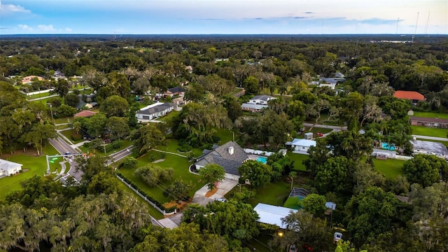 drone / aerial view featuring a forest view