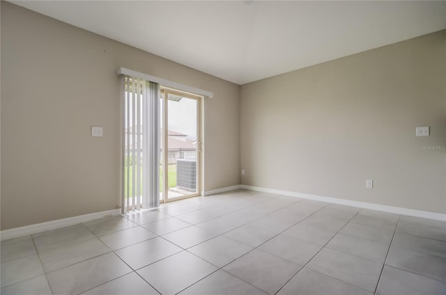 unfurnished room with light tile patterned floors