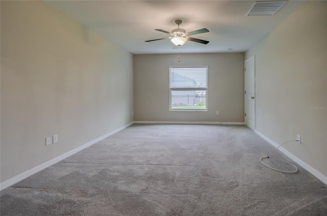 unfurnished room featuring ceiling fan and light carpet