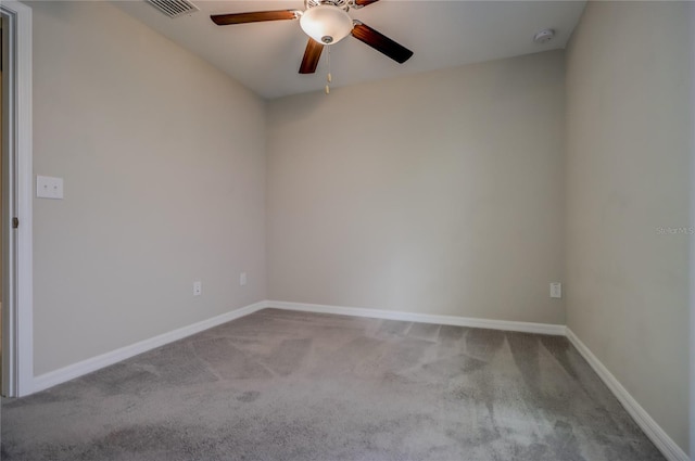 unfurnished room featuring ceiling fan and carpet floors