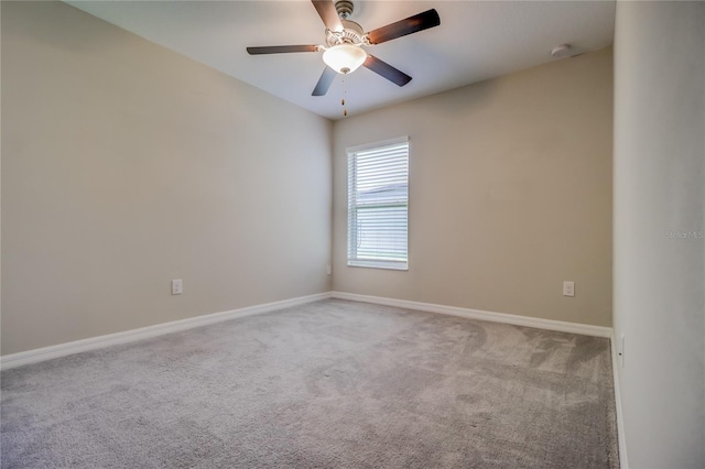 carpeted empty room with ceiling fan