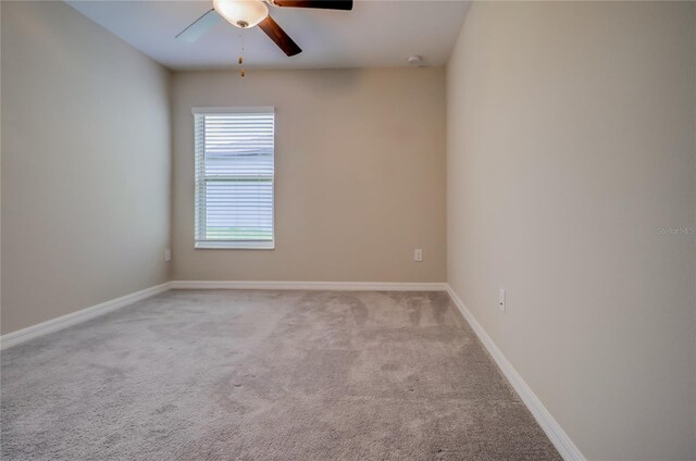 unfurnished room with ceiling fan and light carpet