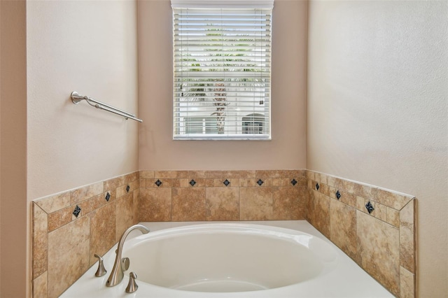 bathroom featuring a tub to relax in