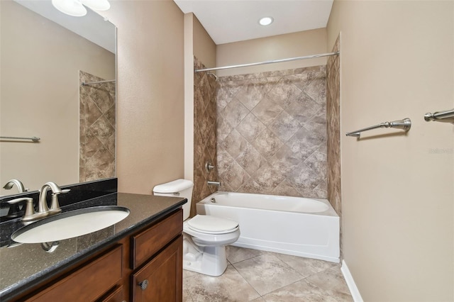 full bathroom featuring tiled shower / bath combo, vanity, toilet, and tile patterned flooring