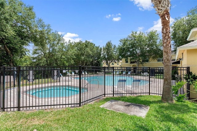 view of pool featuring a yard