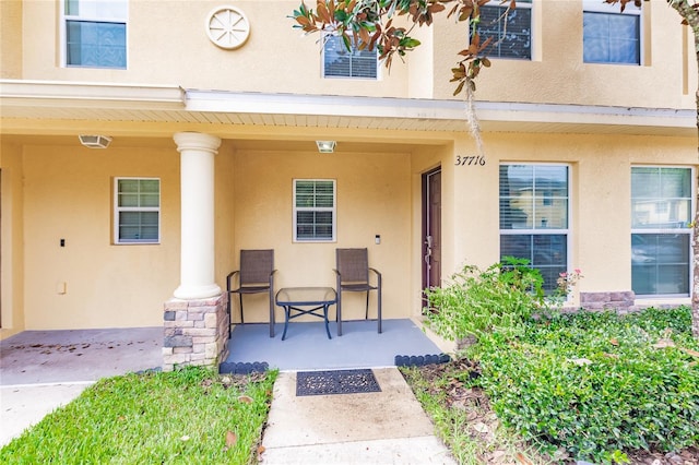 doorway to property featuring covered porch