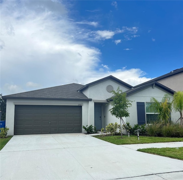 ranch-style home with a garage