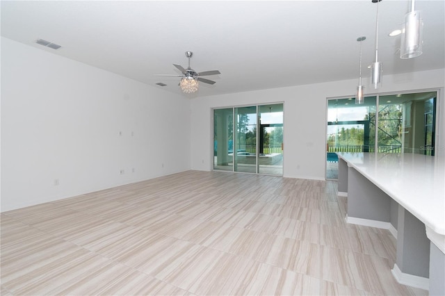 unfurnished room featuring ceiling fan