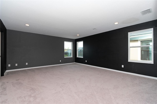 empty room with light colored carpet