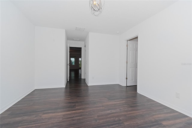 spare room featuring dark hardwood / wood-style floors