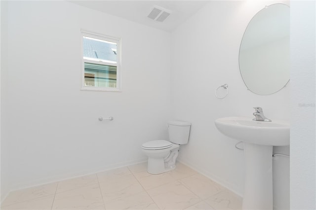 bathroom featuring sink and toilet