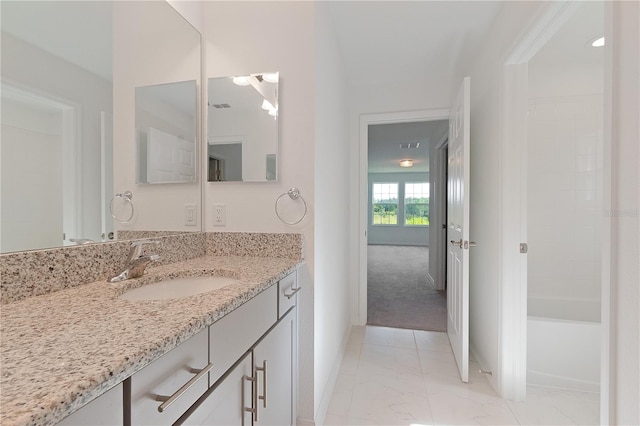 bathroom with vanity and a bathing tub